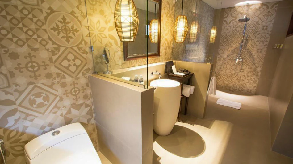 Luxurious bathroom at Lembongan Beach Club & Resort with patterned walls and stylish lighting.