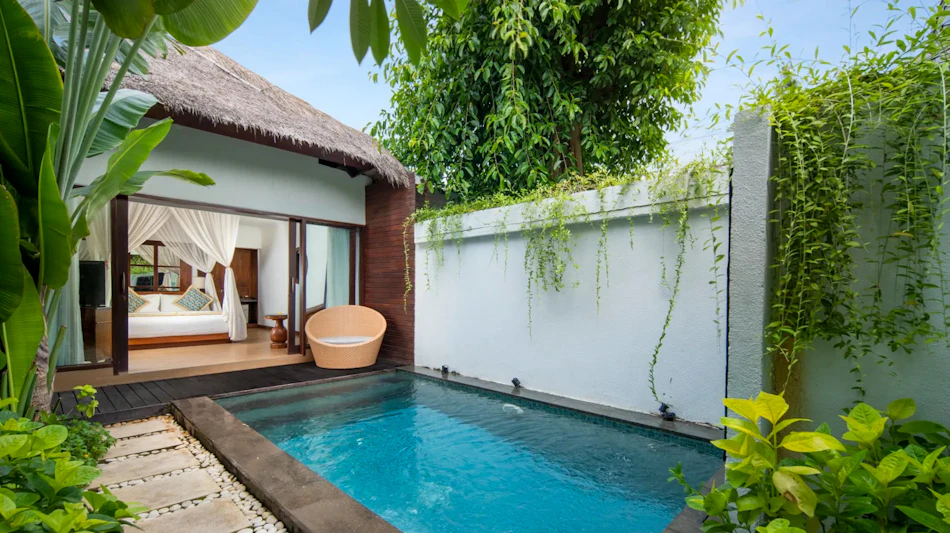 A luxurious private villa with a thatched roof and plunge pool at Lembongan Beach Club & Resort.
