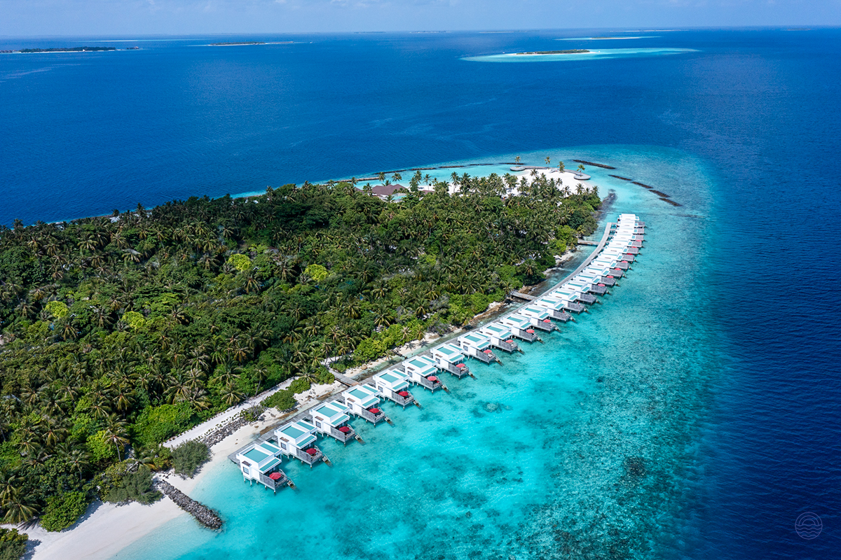 Luxurious overwater villas line the pristine turquoise waters of Dhigali Maldives, a tropical paradise.