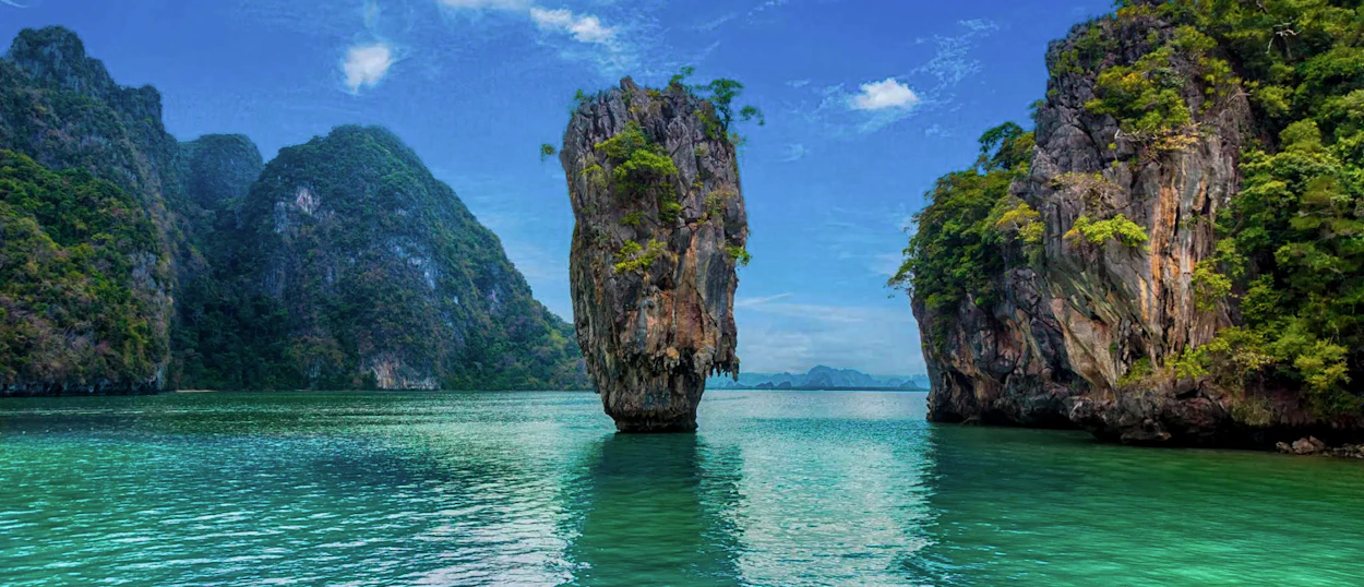 Iconic James Bond Island rises from the clear turquoise waters of Phang Nga Bay, Thailand.